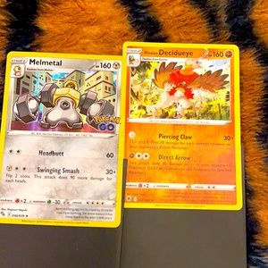 Pokémon cards melmetal and decidueye card